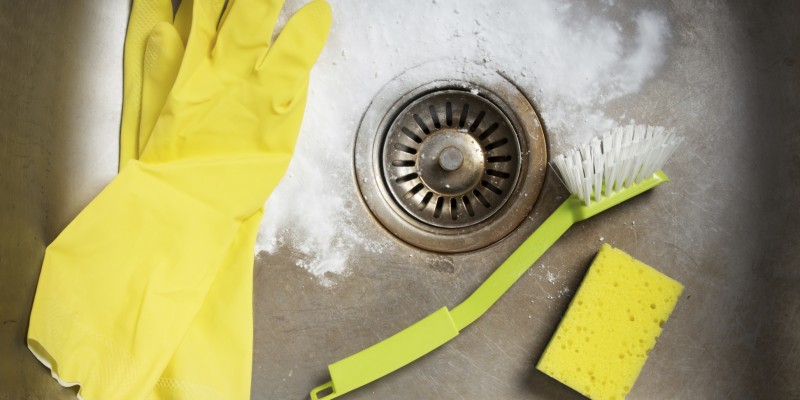 Preparing to clean the sink